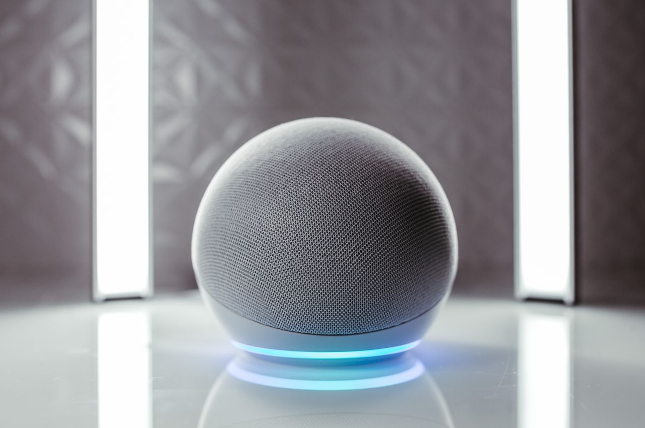About Close-up of a spherical smart speaker with illuminated base, perfect for modern interiors.